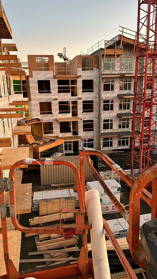 Timber framing and construction equipment on a jobsite